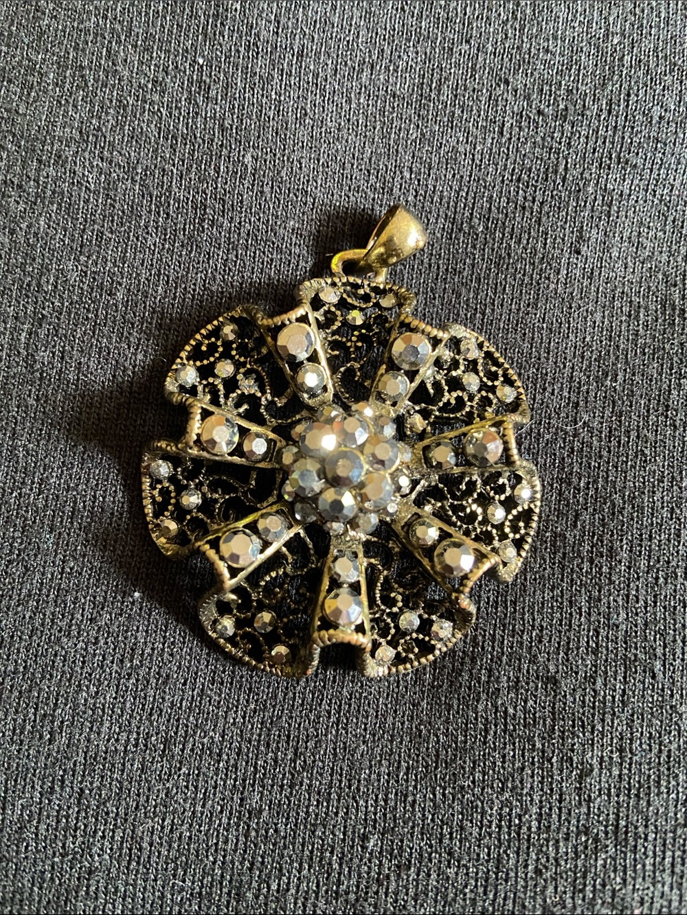 Gold-Tone Black Filigree Flower Pendant with Clear Crystals